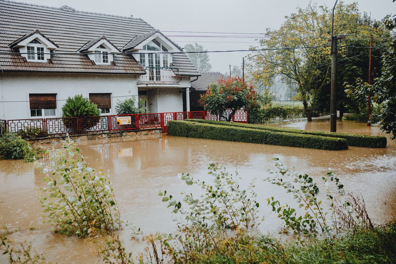 Floodwater around a suburban house after heavy rain