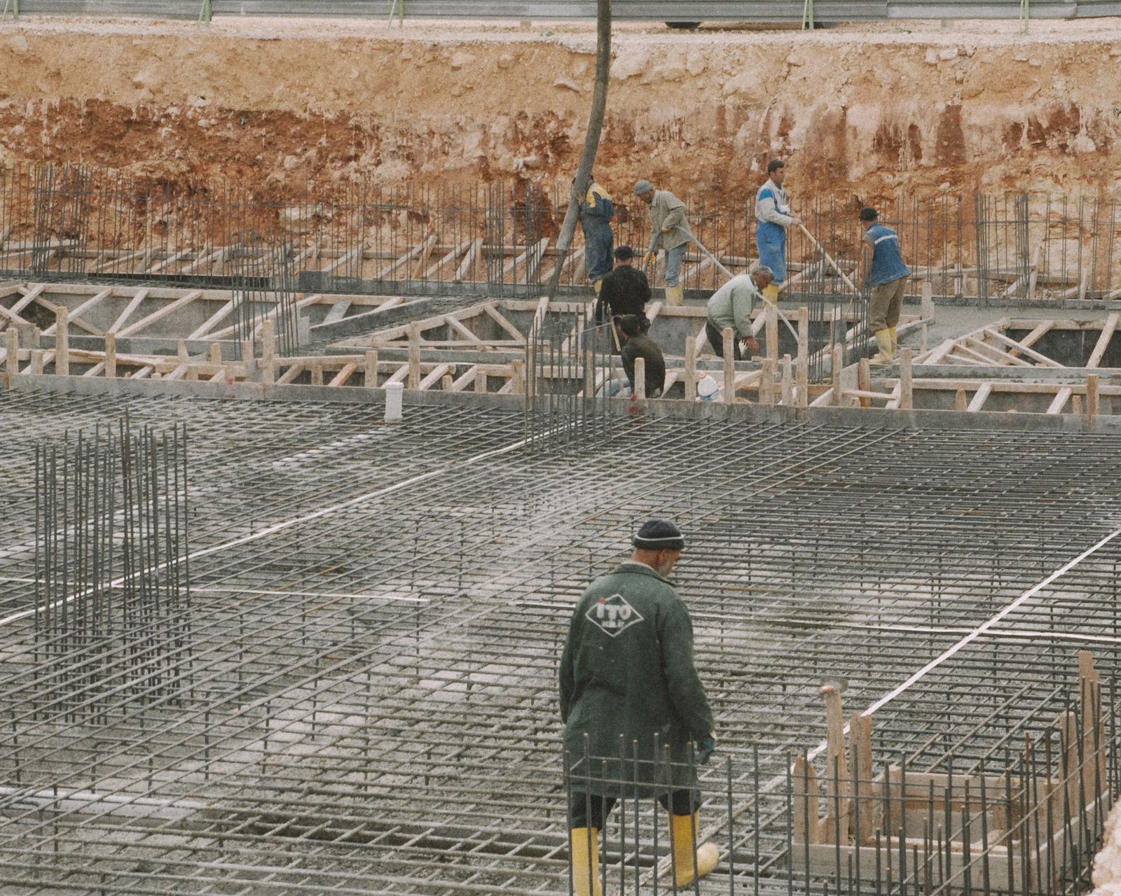 Workers building a reinforced concrete foundation